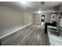 Open living area with gray walls and wood-look floors at 2308 Lakewood Sw Ave, Atlanta, GA 30315