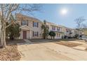 Row of townhouses with parking lot and small yards at 320 Goldenrod Dr, Stockbridge, GA 30281