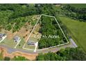 Beautiful 4.67-acre lot surrounded by lush greenery offers a tranquil and private setting at 85 Woodfin Way, Social Circle, GA 30025