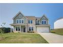 Two-story house with gray siding, stone accents, and a two-car garage at 151 Buffalo Trce, Stockbridge, GA 30281