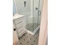 Updated bathroom with white subway tile and patterned floor at 64 Goldrush Cir, Atlanta, GA 30328