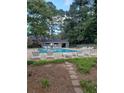 Relaxing community pool with plenty of lounge chairs at 64 Goldrush Cir, Atlanta, GA 30328
