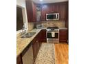 Updated kitchen with stainless steel appliances and granite countertops at 64 Goldrush Cir, Atlanta, GA 30328