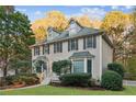 Two story house with gray siding, shutters, and landscaping at 7470 Wynfield Dr, Cumming, GA 30040