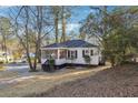White house with a screened porch and yard, side view at 2178 Baker Nw Ter, Atlanta, GA 30318