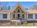 Inviting front entrance with stone accents and a covered porch at 1609 N County Line Rd, Lithia Springs, GA 30122
