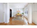 Bright dining room with hardwood floors and chandelier at 970 Samples Nw Ln, Atlanta, GA 30318