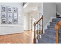 Bright and spacious entryway with hardwood floors and staircase at 2151 Lake Haven Way, Suwanee, GA 30024