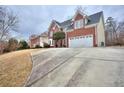 Long driveway leading to a two-car garage at 6764 Blantyre Blvd, Stone Mountain, GA 30087