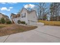 House exterior boasts a two-car garage and a welcoming front porch at 954 Josie Ct, Lawrenceville, GA 30045