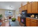 Kitchen with breakfast nook, hardwood floors, and an island at 954 Josie Ct, Lawrenceville, GA 30045