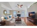 Bright living room features hardwood floors and a cozy fireplace at 954 Josie Ct, Lawrenceville, GA 30045