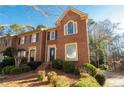 Attractive brick townhouse with landscaping and a private driveway at 1229 Whitlock Ridge Sw Dr, Marietta, GA 30064