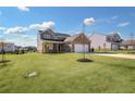 Two-story home with brick and siding exterior, two-car garage, and landscaped lawn at 509 Elkwood Ln, Mcdonough, GA 30252