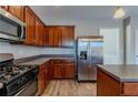 Kitchen with stainless steel appliances and wood cabinets at 7336 Toccoa Cir, Union City, GA 30291