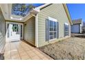 House exterior showcasing a side entrance and neat landscaping at 175 Paris Dr, Lawrenceville, GA 30043