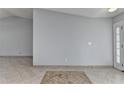 Spacious living room featuring tile flooring and a light gray wall at 175 Paris Dr, Lawrenceville, GA 30043