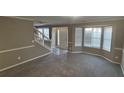 Bright living room featuring bay window and neutral decor at 710 Ridge Way, Lithonia, GA 30058