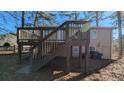 Elevated back deck with stairs leading to the ground at 2531 Ridgecrest Nw Dr, Kennesaw, GA 30152