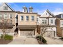 Three-unit townhome development showcasing attractive brick facade and landscaping at 3465 Fenton Se Dr, Smyrna, GA 30080