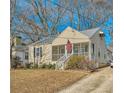 Cute ranch home with a screened porch and American flag at 461 Trabert Nw Ave, Atlanta, GA 30309