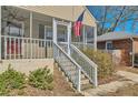 Inviting front porch with steps leading to the front door at 461 Trabert Nw Ave, Atlanta, GA 30309