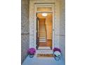 Bright and airy entryway with staircase and decorative doormat at 455 Duval Dr, Alpharetta, GA 30009