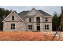 Two-story brick home with large windows and a classic design, set in a spacious lot at 4830 Cool Springs Rd, Winston, GA 30187