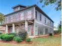 The exterior of this beautiful home features mature landscaping and plenty of yard space at 1520 Vassar Ave, College Park, GA 30337