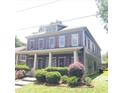 Inviting two-story home boasts a classic design, front porch, and lovely curb appeal at 1520 Vassar Ave, College Park, GA 30337