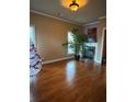 Cozy living room with fireplace and large windows to bring in natural light at 1520 Vassar Ave, College Park, GA 30337