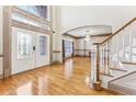 Elegant entryway with hardwood floors, double doors, and staircase at 4265 Eddie Byrd Ln, Loganville, GA 30052