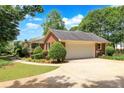 Attached brick garage with ample driveway space at 114 Tracy Ln, Mcdonough, GA 30253