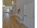 Light-filled entryway with hardwood floors and elegant console table at 6320 Glen Oaks Ln, Sandy Springs, GA 30328