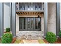 A flagstone patio with French doors leading to the house at 92 Sheridan Dr, Atlanta, GA 30305