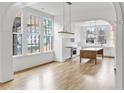 Bright kitchen with an island, white cabinets, and hardwood floors at 92 Sheridan Dr, Atlanta, GA 30305