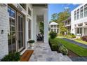 Front porch with stone flooring and access to the home at 11610 Folia Cir, Alpharetta, GA 30005