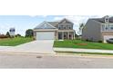 Two-story home with a front porch and attached two-car garage at 316 Foxglove Way, Mcdonough, GA 30253