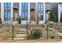 Modern townhouses with orange doors and black metal fence at 457 Parkway Ne Dr, Atlanta, GA 30308