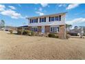 Two-story house with a brick facade and a large grassy yard at 2210 Lisa Se Dr, Marietta, GA 30067