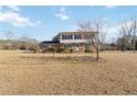 Two-story house with a brick facade and a large yard at 2210 Lisa Se Dr, Marietta, GA 30067
