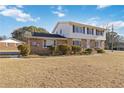 Two-story house with brick and vinyl siding, showcasing a large front yard at 2210 Lisa Se Dr, Marietta, GA 30067