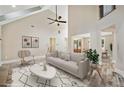 Bright living room boasts vaulted ceilings and neutral decor, creating an inviting and spacious atmosphere at 220 Autumn Brook Dr, Canton, GA 30115