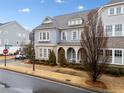 Two-story home with gray siding, charming porch, and landscaping at 228 Dawson Dr, Woodstock, GA 30188