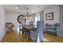 Elegant dining room with hardwood floors, a wooden table, and high-backed chairs at 257 Regal Nw Dr, Lawrenceville, GA 30046