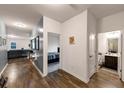 Bright hallway with wood-look floors, leading to bedrooms and bathroom at 7250 Lacey Dr, Douglasville, GA 30134