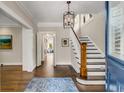 Elegant entryway with hardwood floors, staircase, and view to living room at 1170 Oakdale Rd, Atlanta, GA 30307