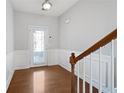 Spacious foyer featuring hardwood floors and a view of the staircase at 216 Parc View Ln, Woodstock, GA 30188