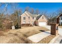 Two-story brick home with a driveway and landscaping at 3811 Breneau Ct, Decatur, GA 30034