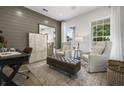 Bright office with wood floors, two armchairs, and a desk at 428 Dahlia St, Mcdonough, GA 30253